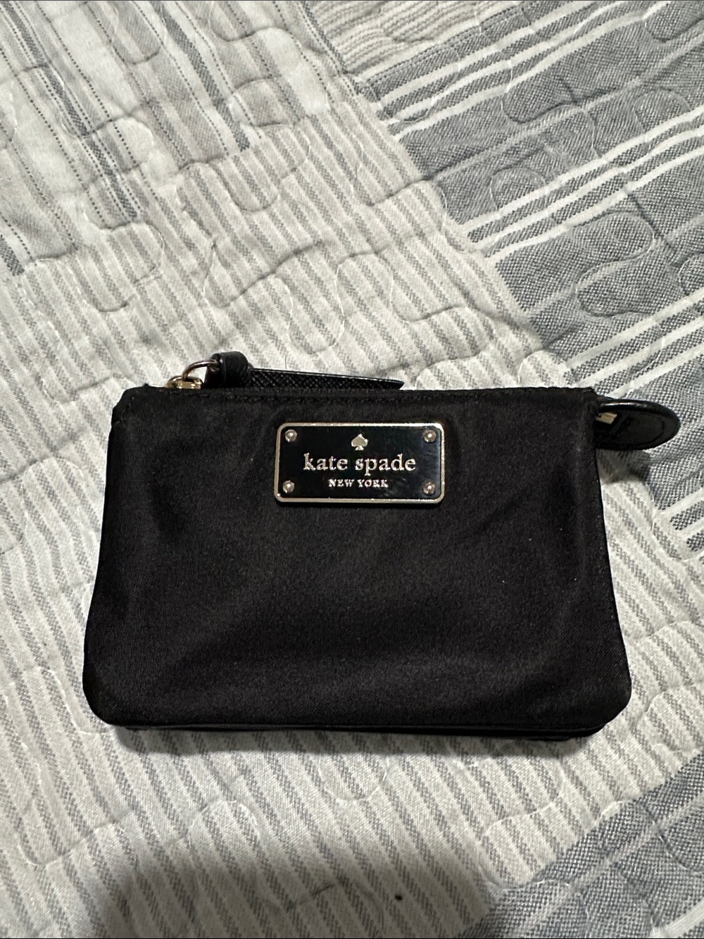 kate spade black nylon pouch with gold logo plate